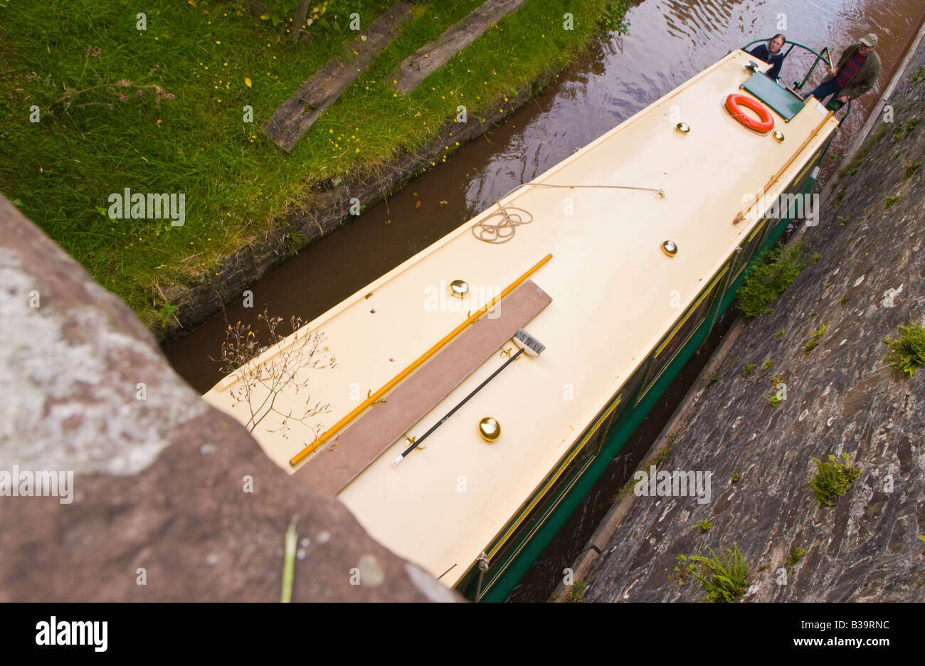Canalboat entering the Ashford Tunnel on the Monmouthshire and Brecon Canal near Crickhowell Powys Wales UK Stock Photo