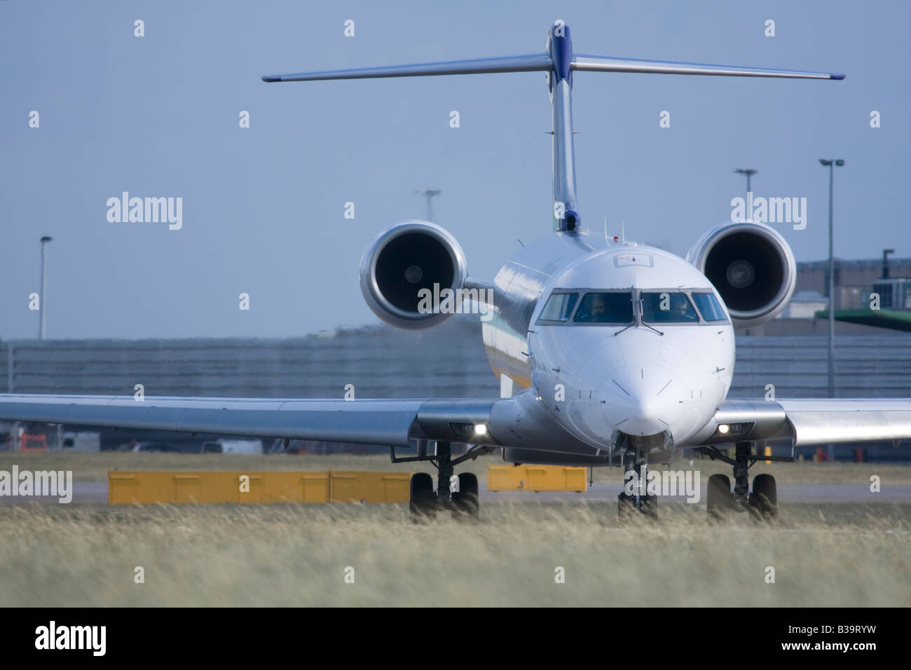 Regional jet taxiing for departure Stock Photo