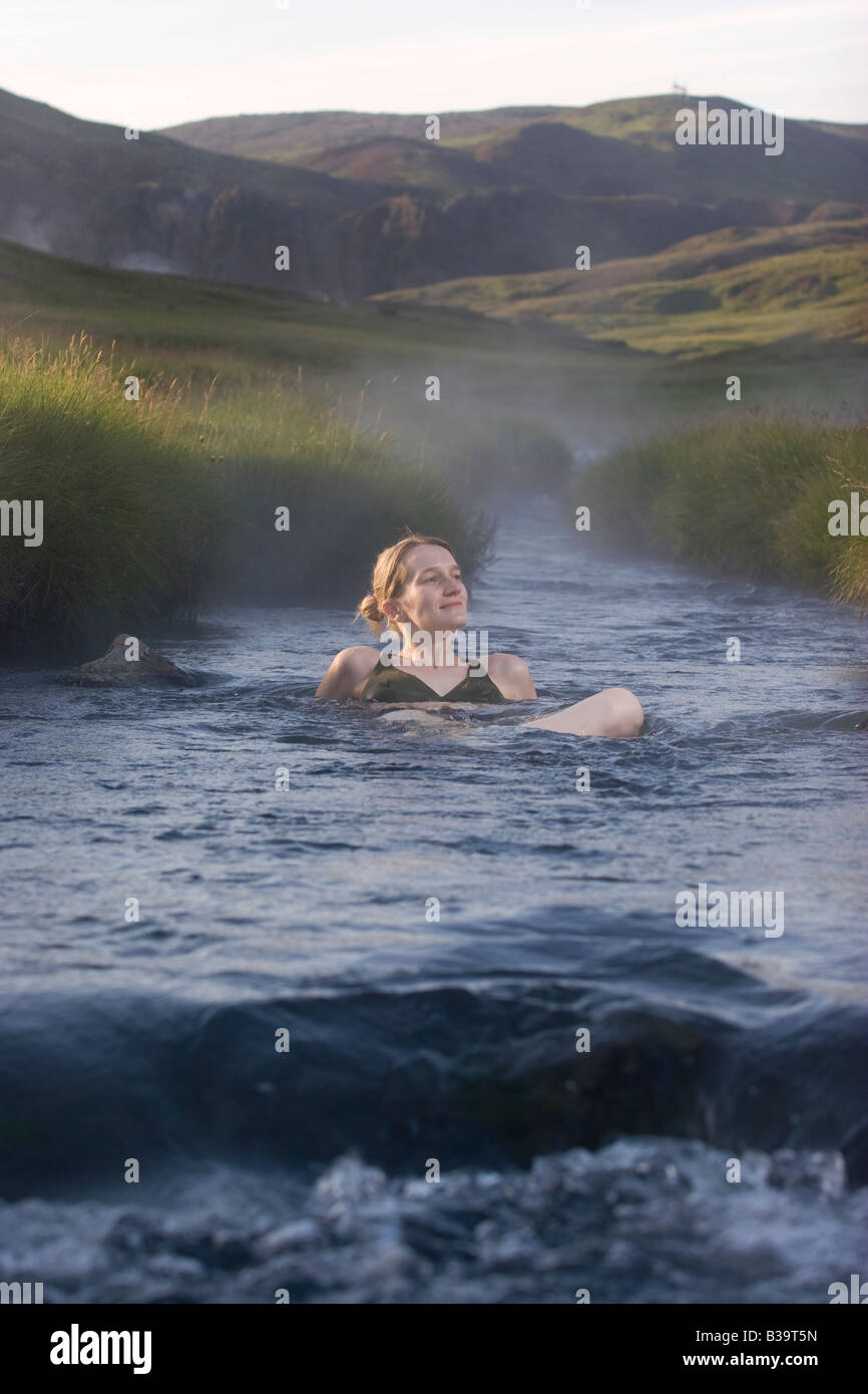 A woman baths in Hveragerdi hot springs, Iceland. Stock Photo