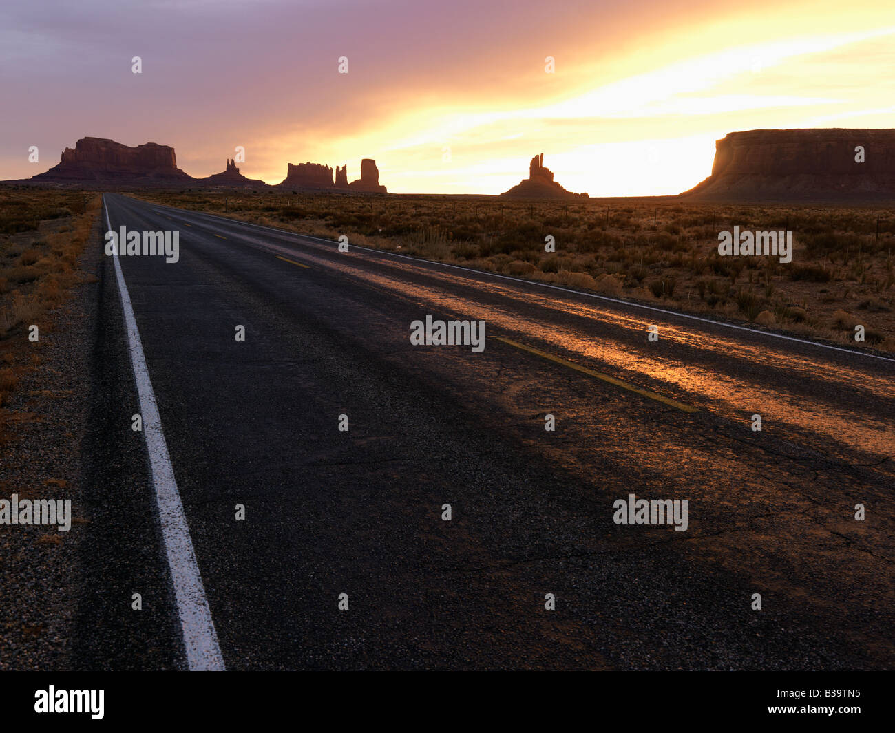 Scenic sunset landscape of highway in Monument Valley on the border of Arizona and Utah United States Stock Photo