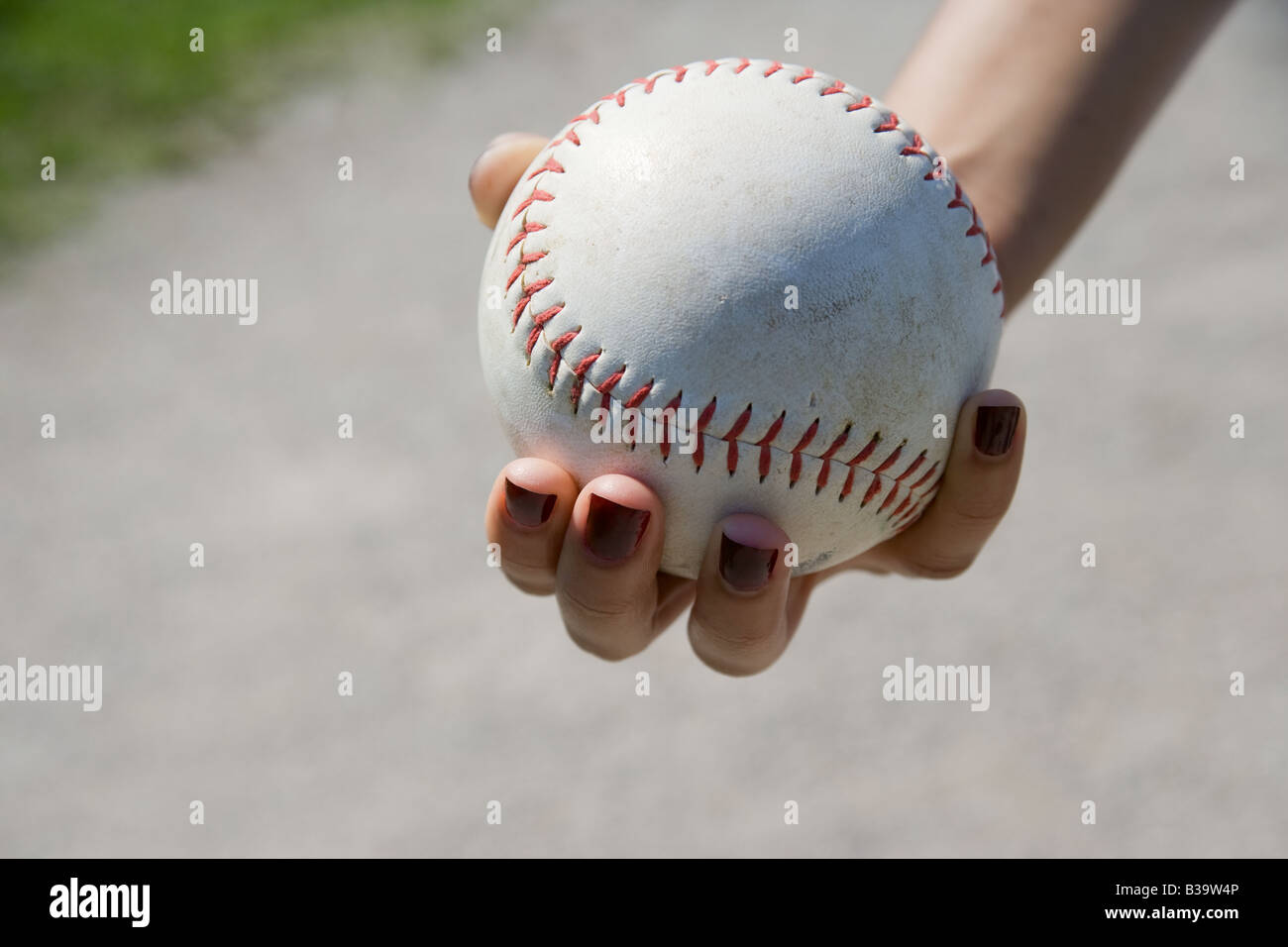 Hand holding a softball Stock Photo Alamy