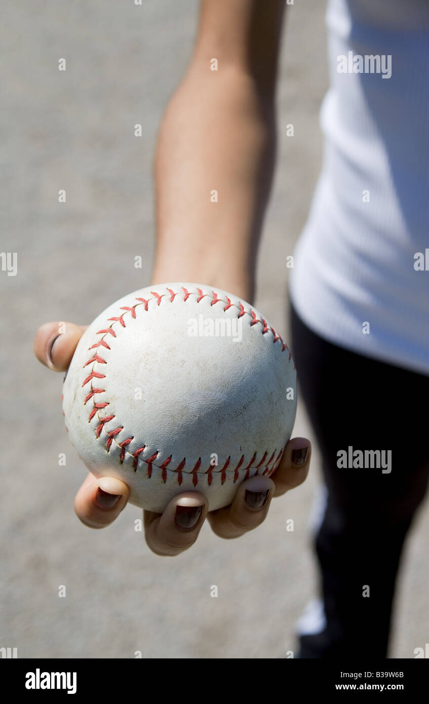 Hand holding a softball Stock Photo Alamy