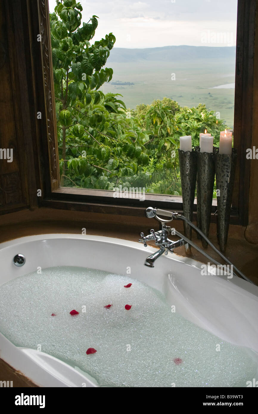 The staff of the five star NGORONGORO CRATER LODGE prepare a BUBBLE BATH for the arrival of guests NGORONGORO CRATER TANZANIA Stock Photo