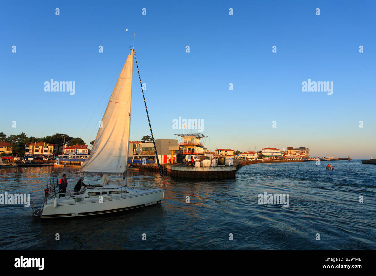 Sailing boat going out of Capbreton harbour France Stock Photo