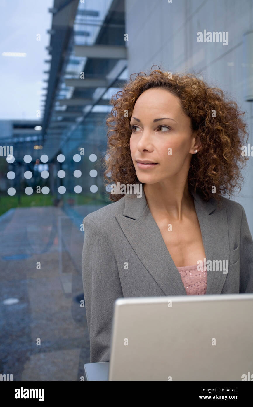African businesswoman next to laptop Stock Photo - Alamy