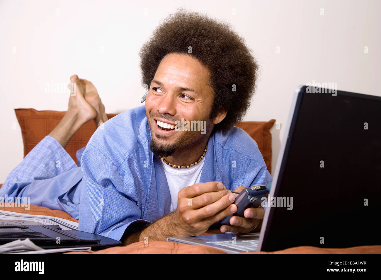 African man using electronic organizer Stock Photo