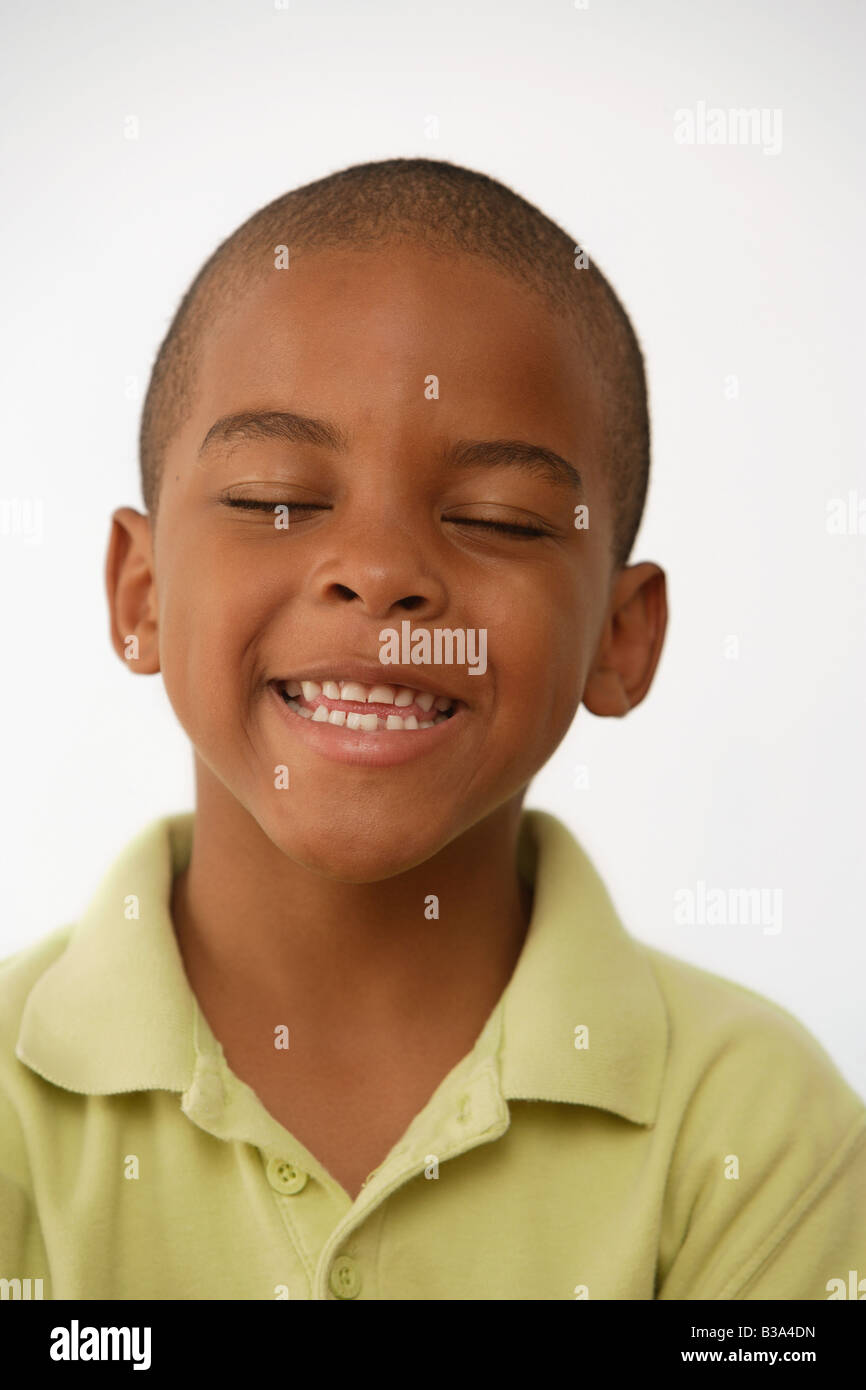 African American boy with eyes closed Stock Photo - Alamy