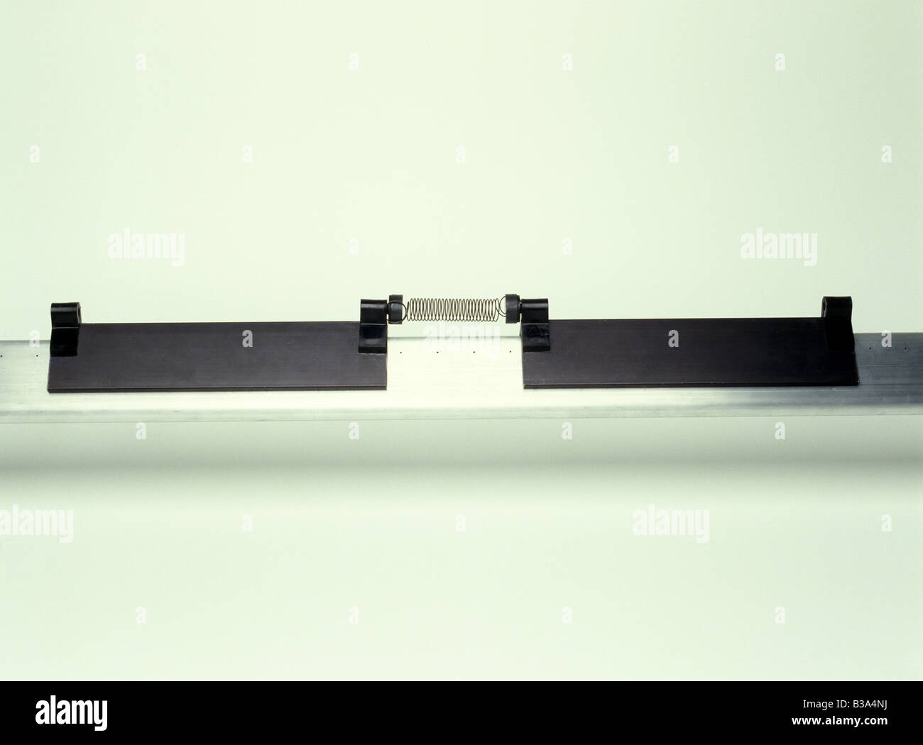 2 gliders magnets and spring Stock Photo