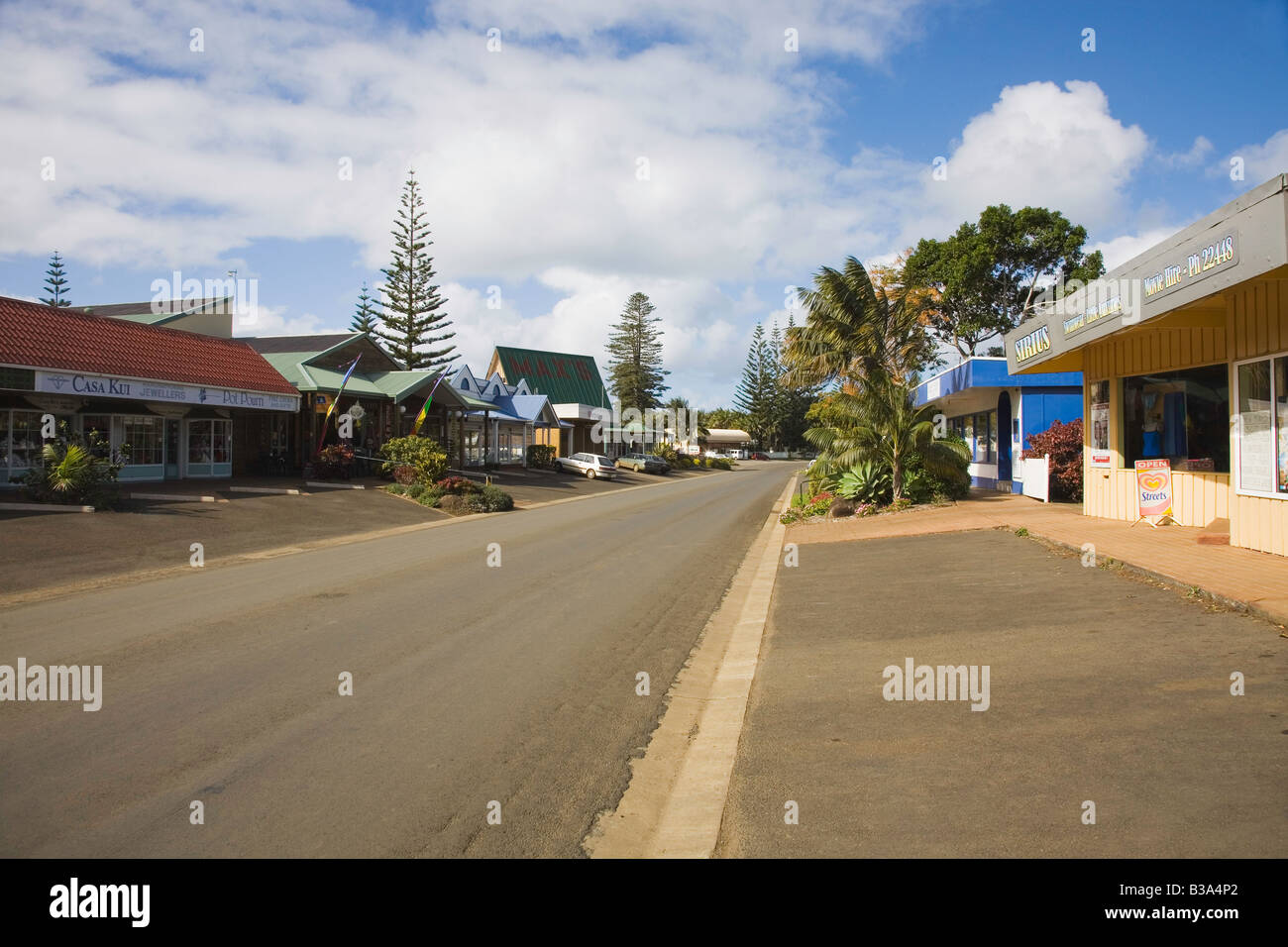 View of the Main High Street in Burnt Pine Township Norfolk Island with shops either side of the road, Norfolk Island, Australia Stock Photo