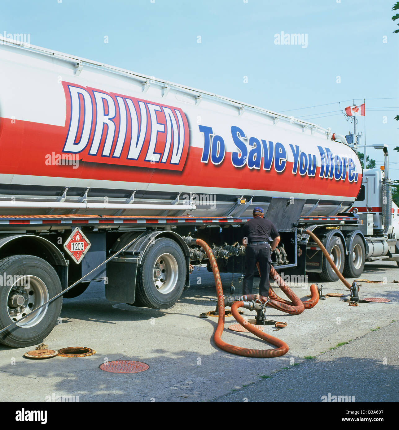 A vapour removal pipe leading from a truck and tanker at a Pioneer gas station in Ontario, Canada Stock Photo