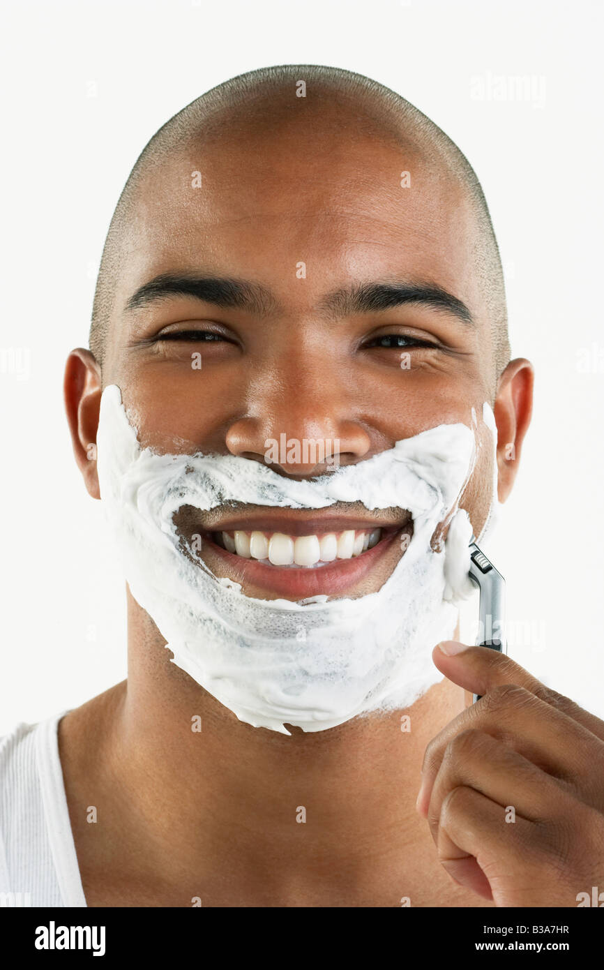 African man shaving face Stock Photo Alamy