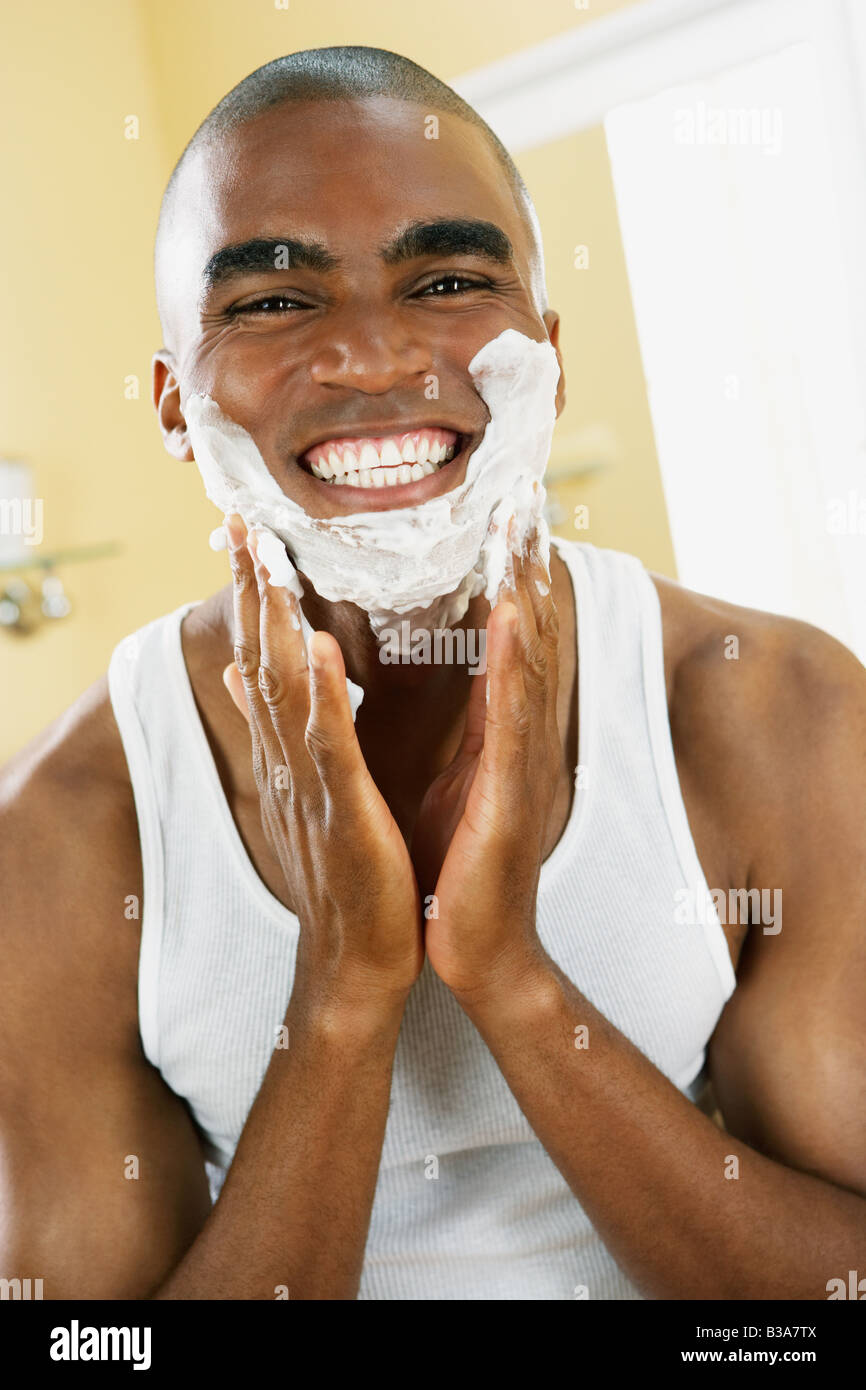 African man applying shaving cream Stock Photo Alamy