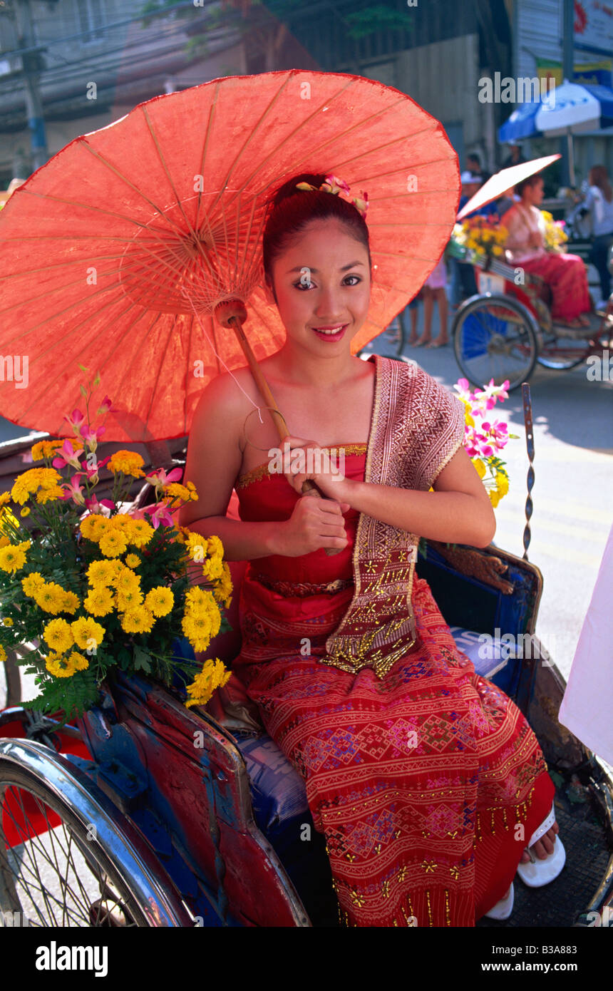 Thailand, Chiang Mai, Girl sitting in Trishaw at the Chiang Mai Flower Festival Parade Stock Photo