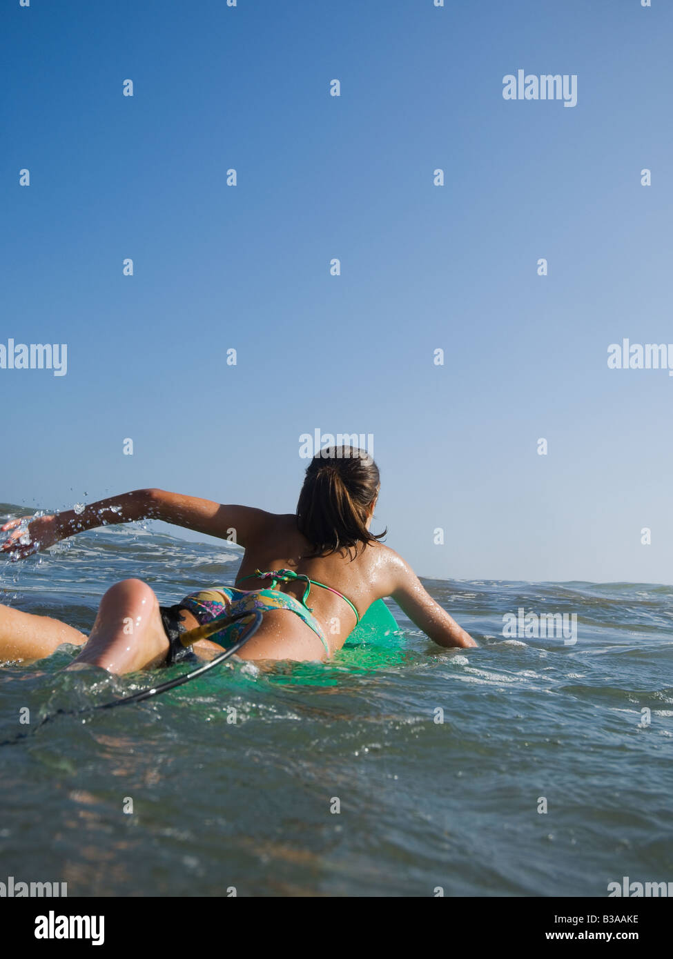 A group of teenagers in bathing suits sitting in water at sunset; Tarifa,  Cadiz, Andalusia, Spain, Stock Photo, Picture And Royalty Free Image. Pic.  DPI-12257528