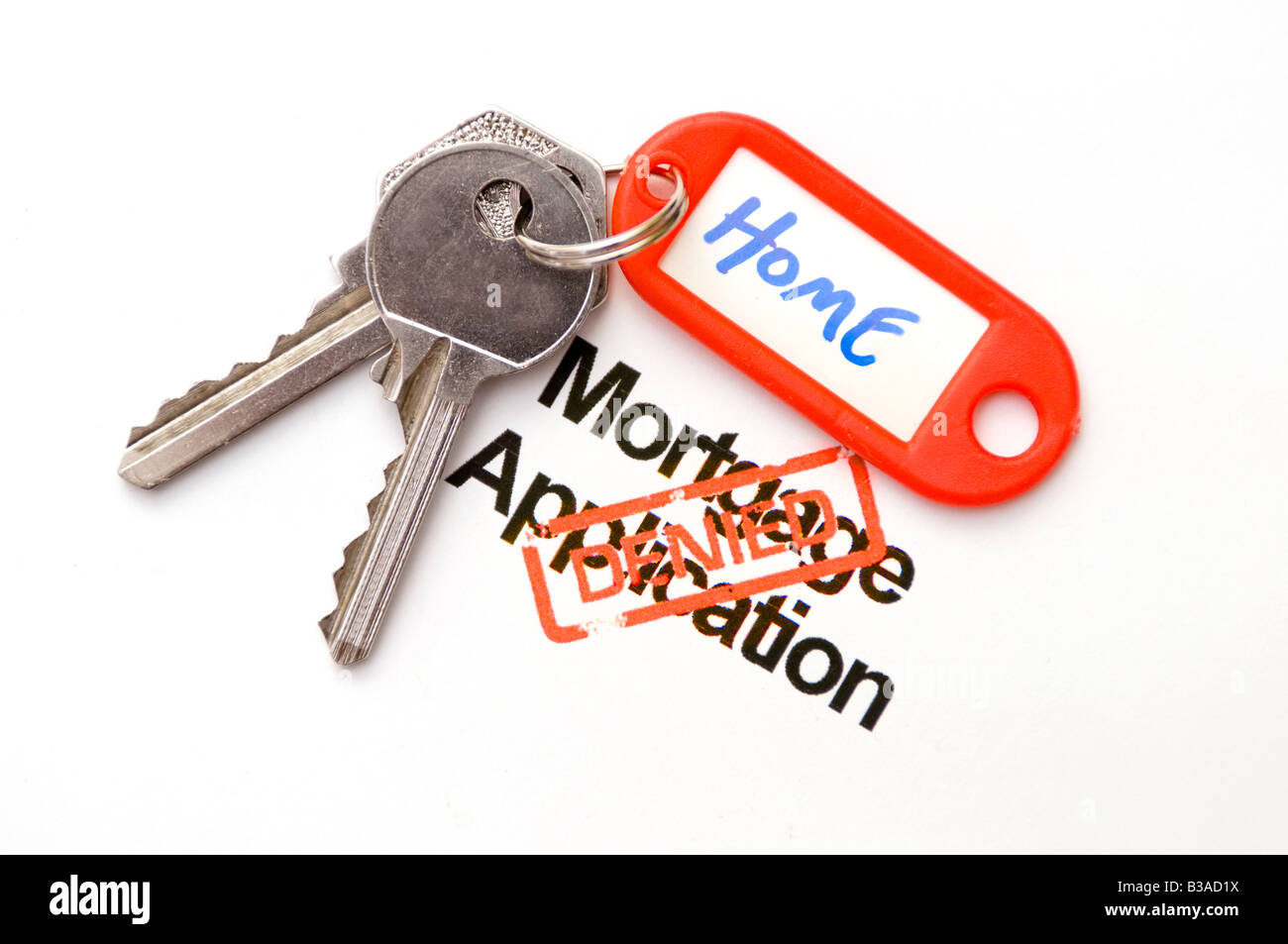 Home keys and mortgage application turned down Stock Photo