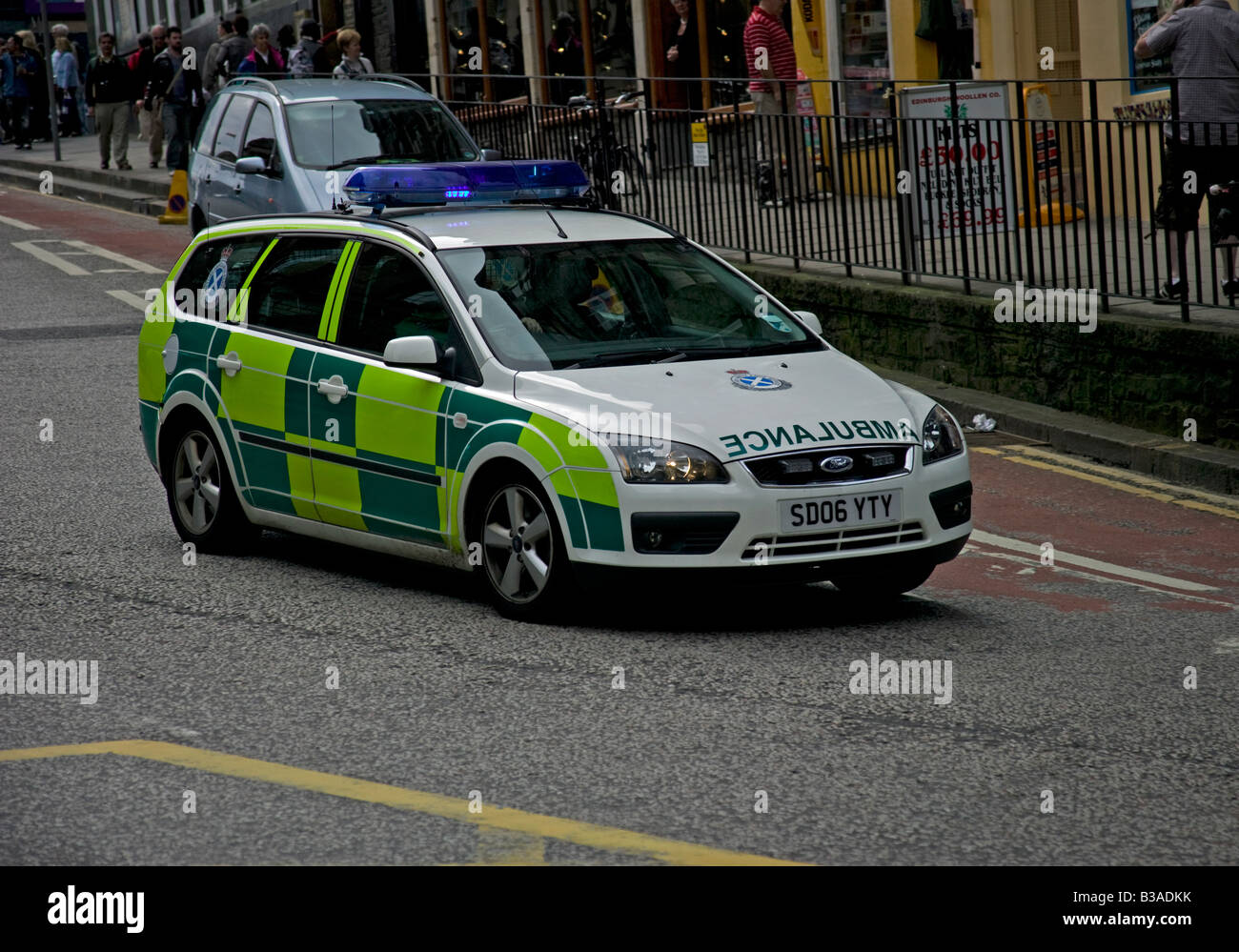 Ambulance vehicle with blue flashing lights proceeding to an emergency, Edinburgh, Scotland, UK, Europe Stock Photo