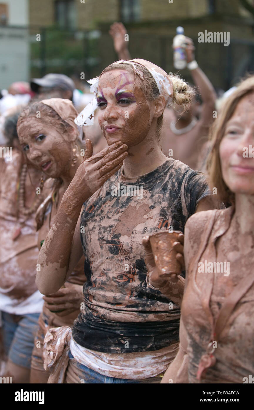 Notting Hill Carnival - Cocoyea. Girls covered in chocolate / mud. Stock Photo