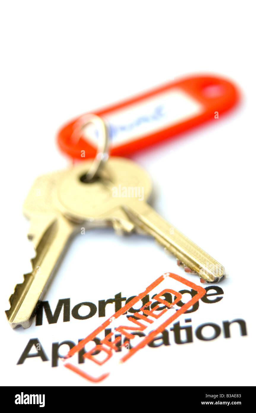 Home keys and mortgage application turned down Stock Photo