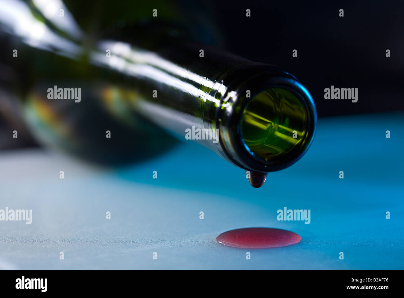 drops leaking from tilted red wine bottle Stock Photo Alamy