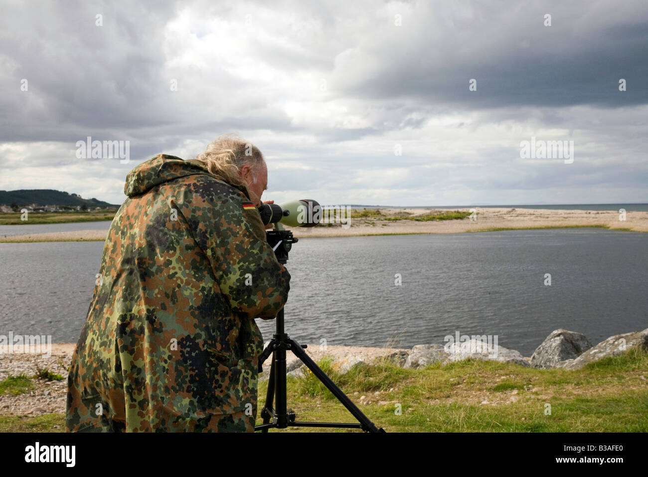 Elderly Man birdwatching  Bird and wildlife watching Spey Bay, Moray Coast, Scotland uk Stock Photo