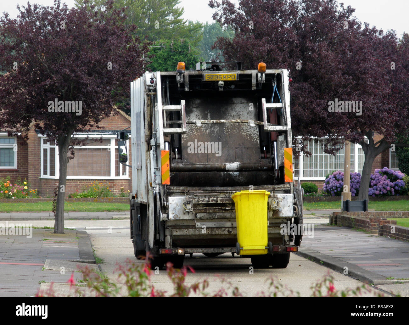 dustcart colllecting rubbish for landfill Worthing Adur area West Sussex reversing down a residential close Stock Photo