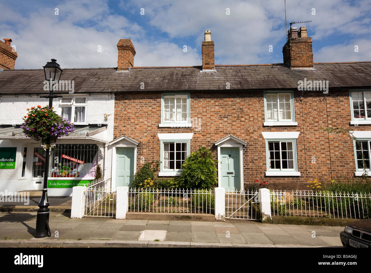 UK Cheshire Tarporley High Street terraced houses with small front gardens Stock Photo