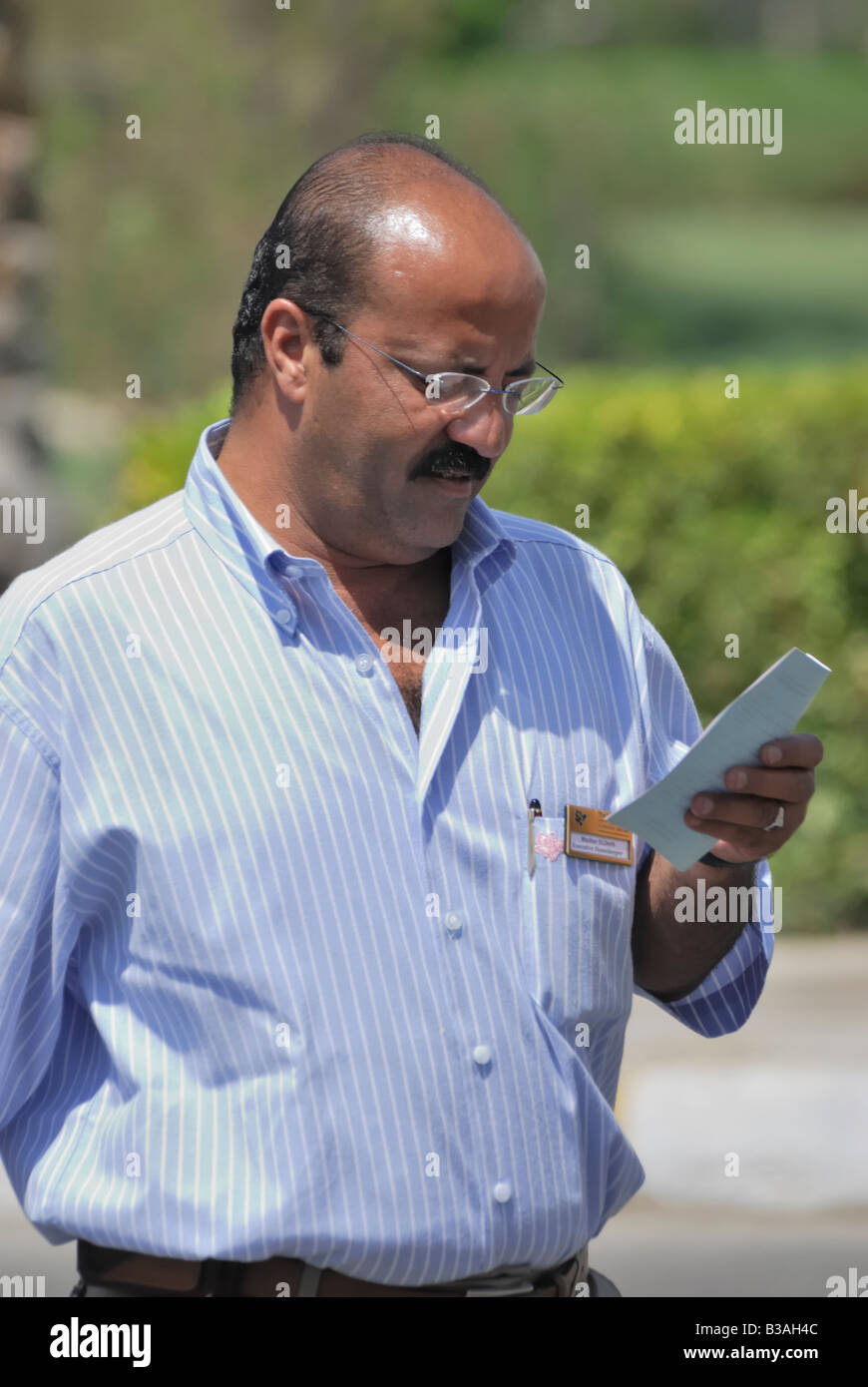 Man in glasses blue shirt hi-res stock photography and images - Alamy