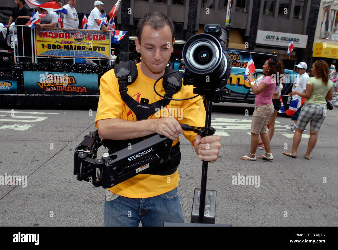 Videographer uses a Steadicam while taping the Dominican Independence Day Parade in New York on August 10 2008 Stock Photo