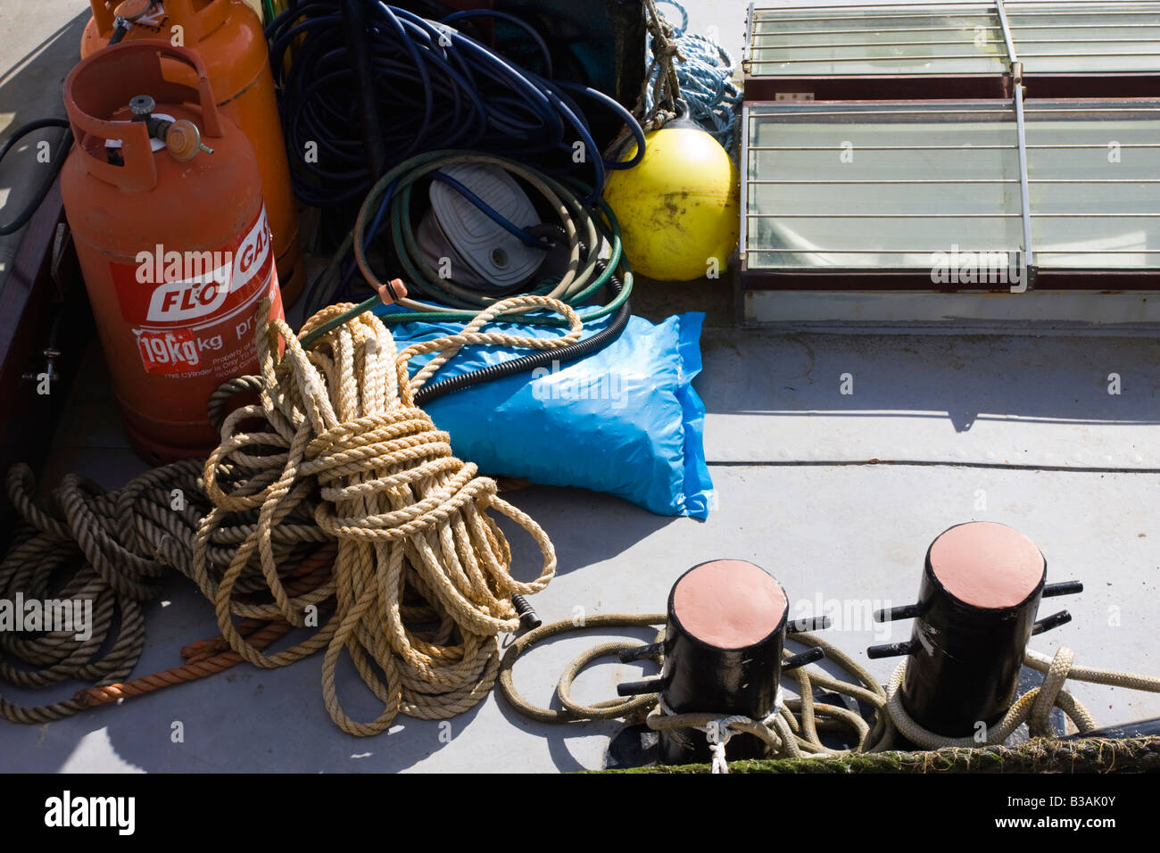 Tangle of ropes and other marine items on the deck of a fishing boat at
