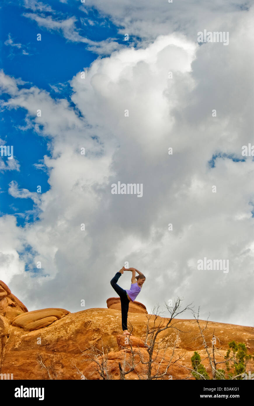 Posing on red rock Arches National Park Utah Stock Photo - Alamy