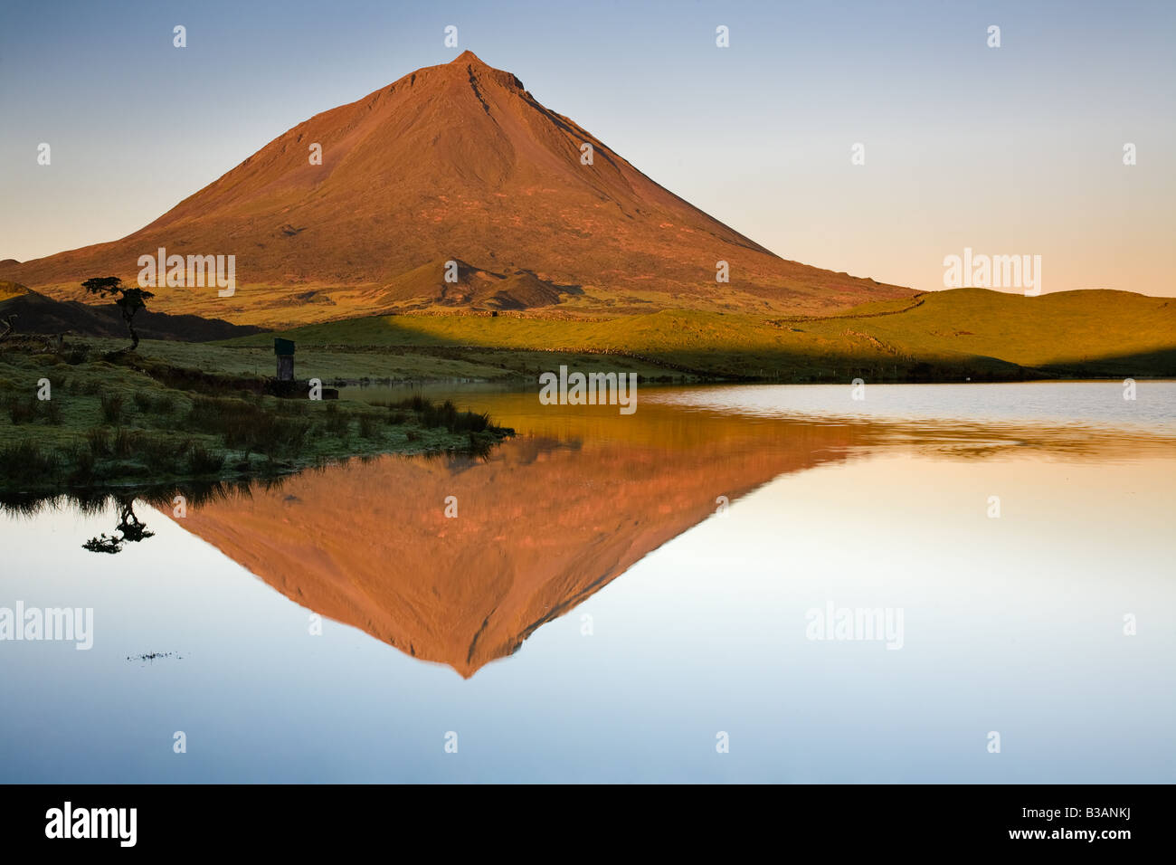 Reflection of the Pico Mountain at sunrise in Captain Lagoon - Pico Island - Azores - Portugal Stock Photo