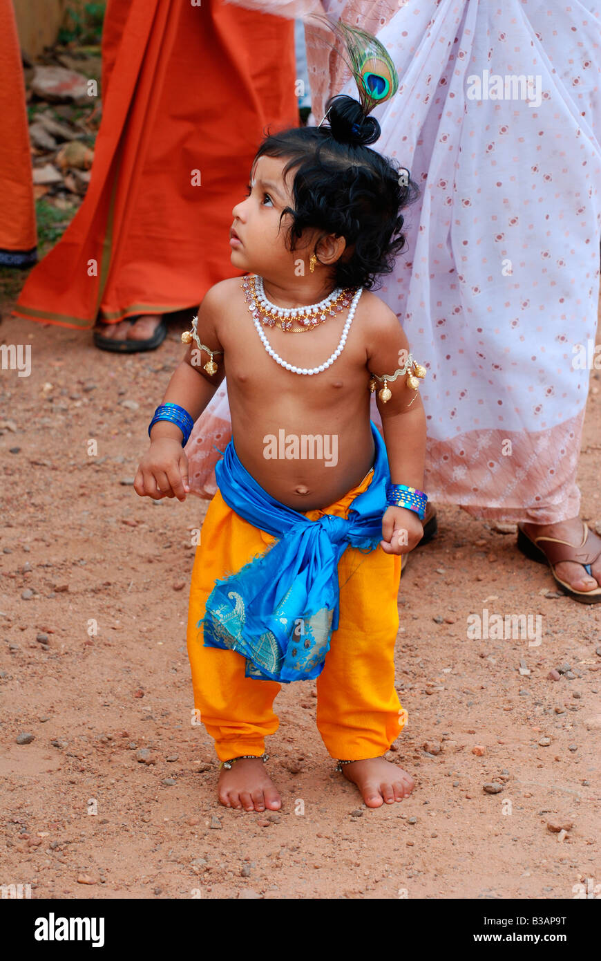 Little Krishna- a small boy posing as lord krishna in a ...