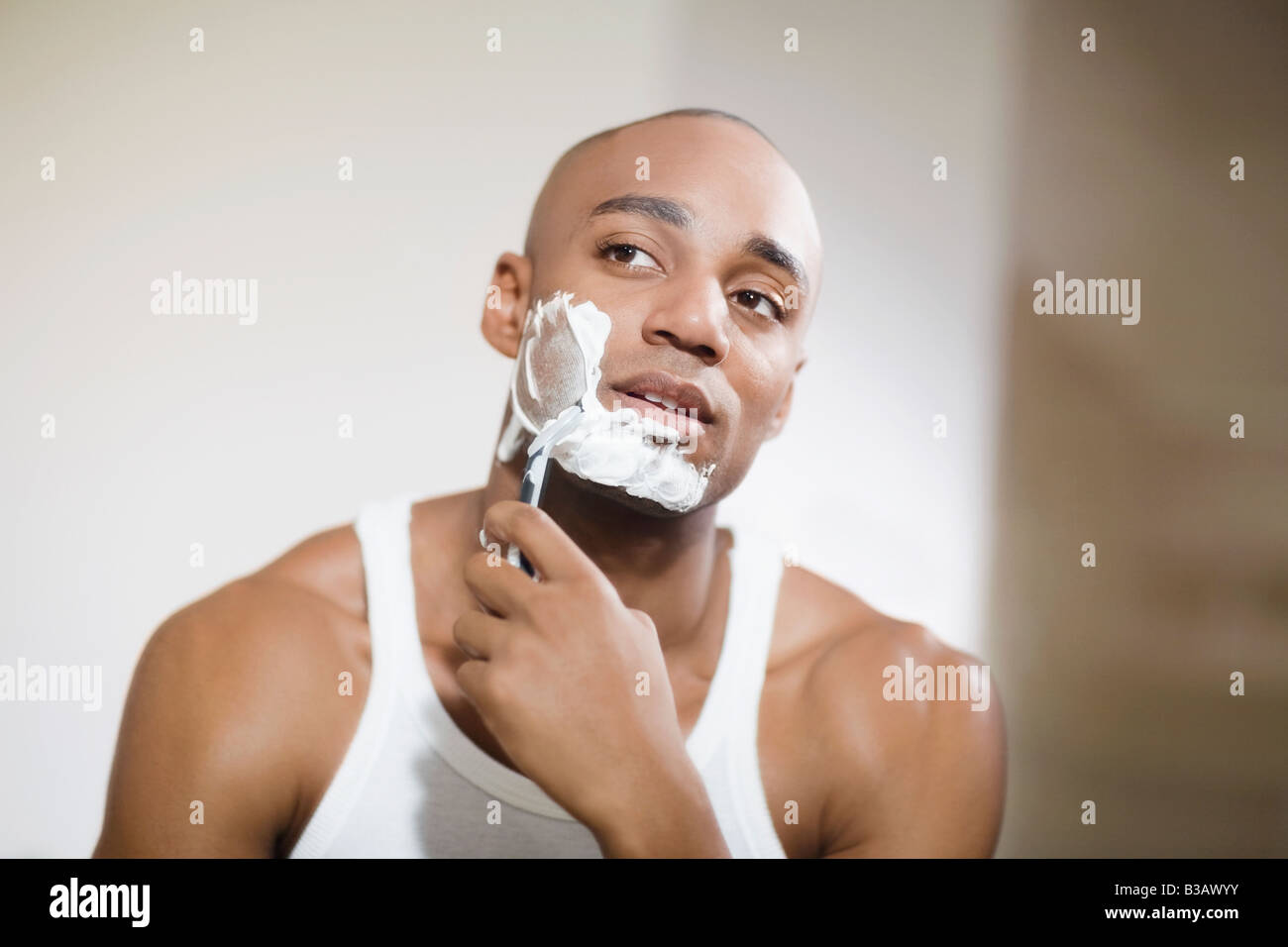 African man shaving face Stock Photo Alamy
