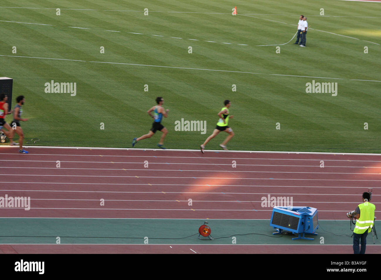 athletics meeting mens track race in motion blur Stock Photo Alamy