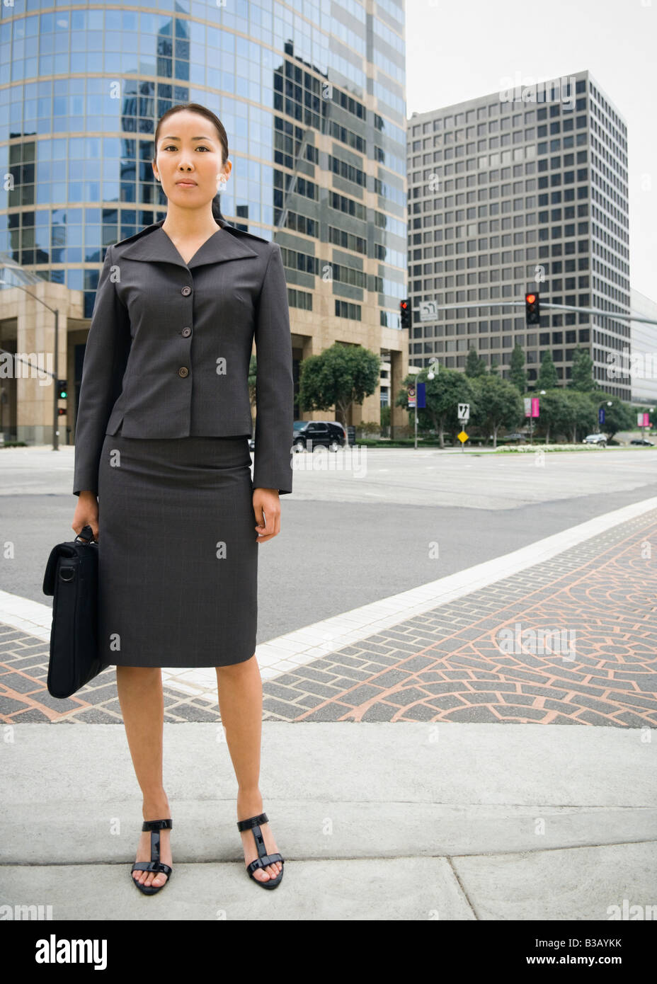 Asian businesswoman in urban area Stock Photo