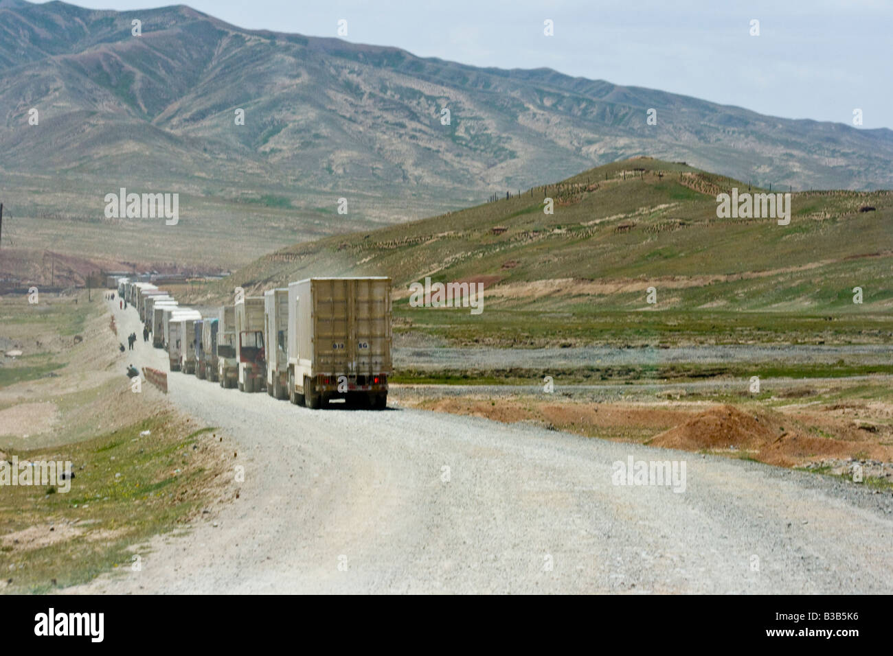 Chinese Trucks Lined Up at the Torugart Pass Kyrgyzstan China Border Crossing Stock Photo