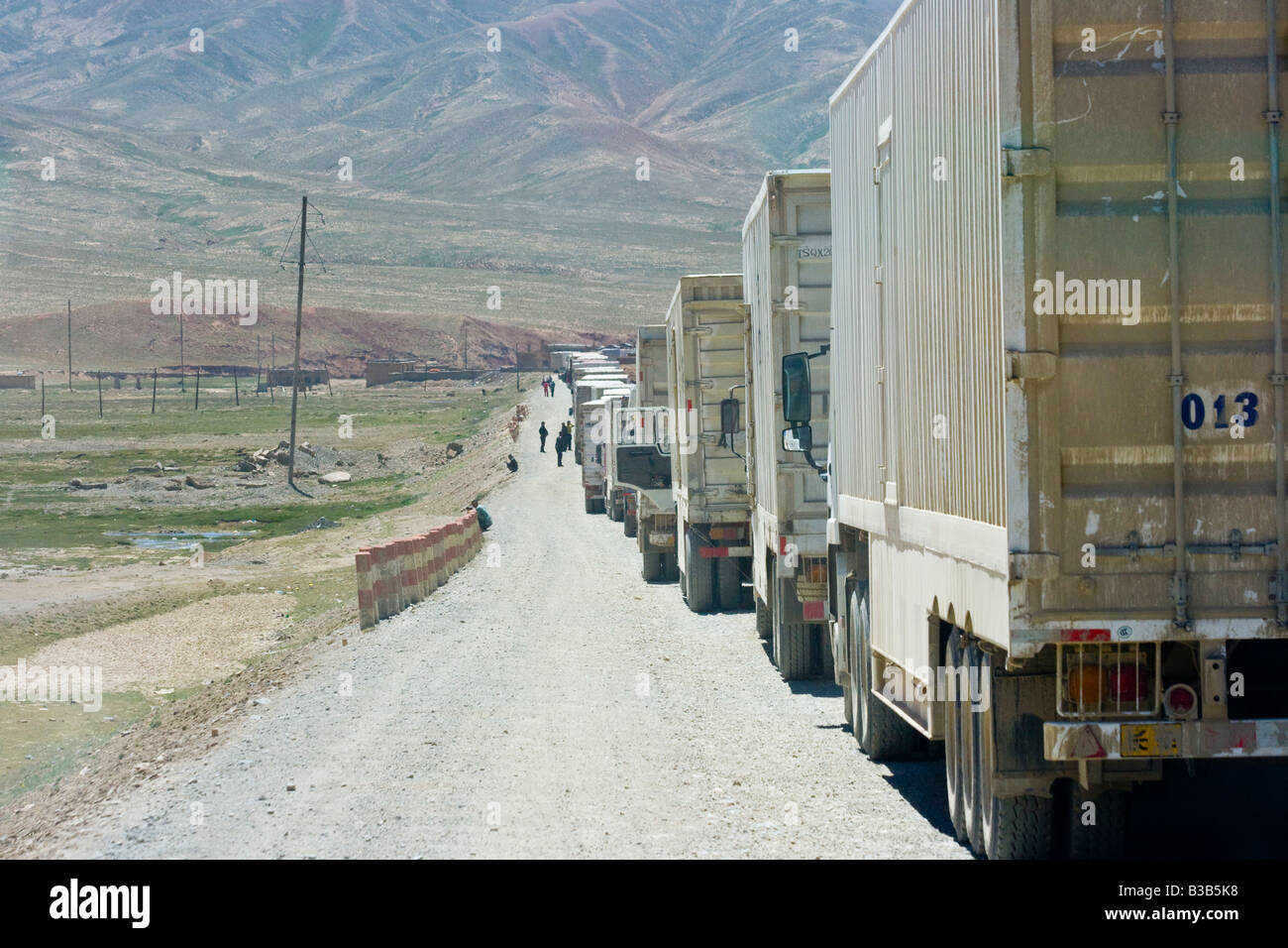Chinese Trucks Lined Up at the Torugart Pass Kyrgyzstan China Border Crossing Stock Photo