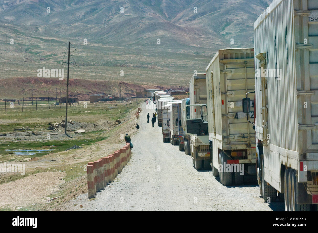 Chinese Trucks Lined Up at the Torugart Pass Kyrgyzstan China Border Crossing Stock Photo