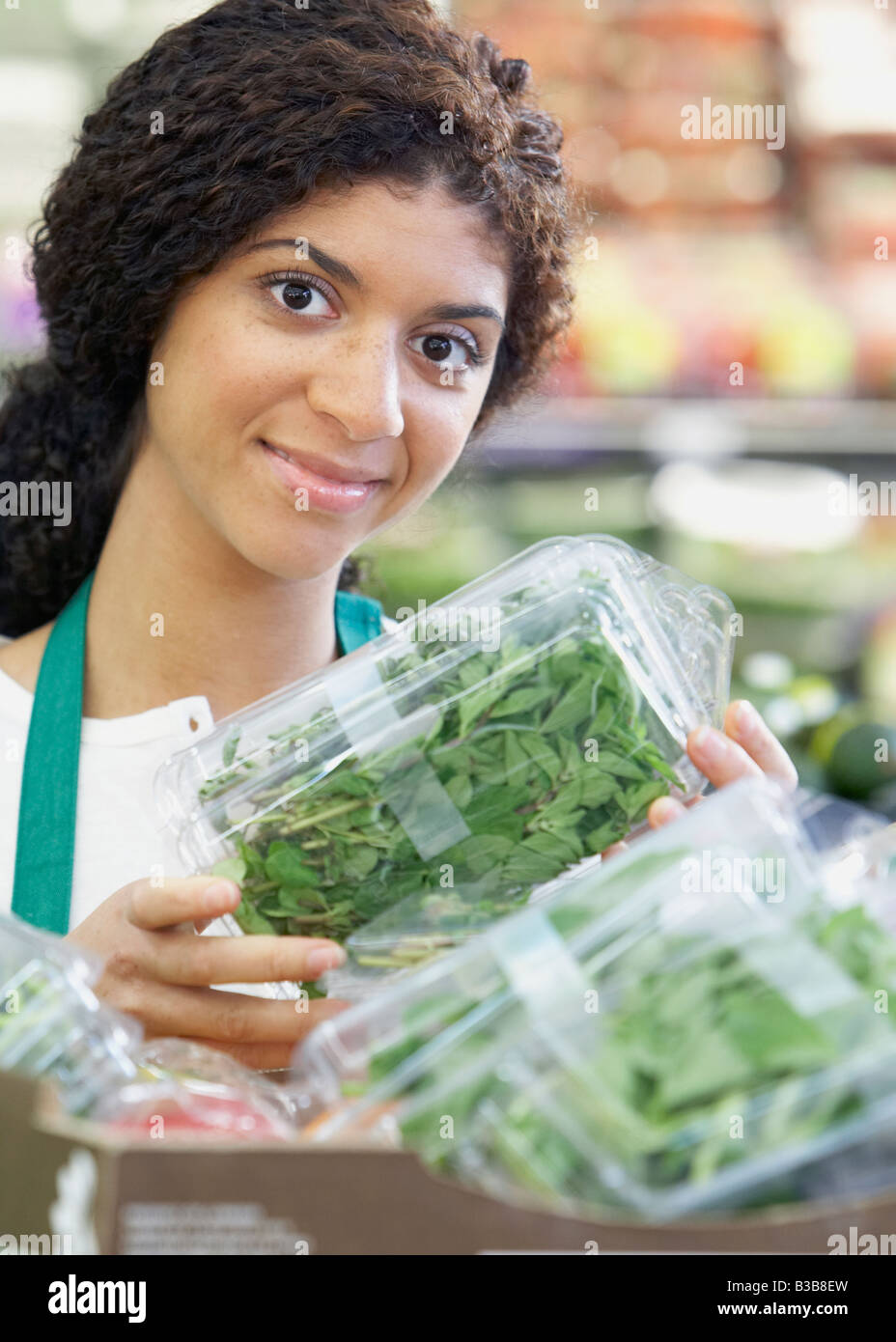 Grocery store employee smiling camera hires stock photography and images Alamy