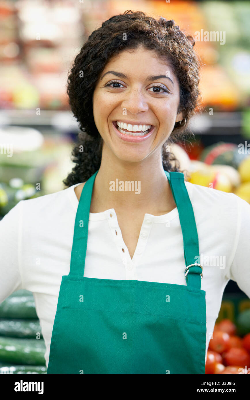 Mixed Race clerk in grocery store Stock Photo Alamy