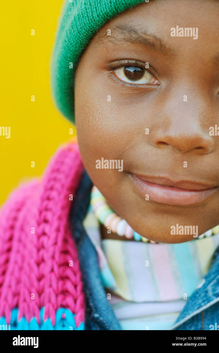 Close up of African girl wearing winter hat Stock Photo