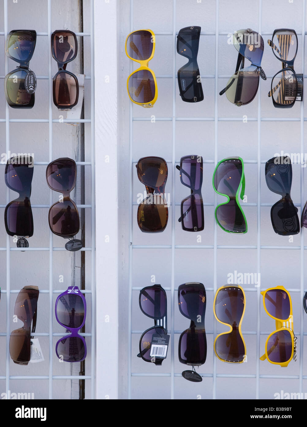 Sunglasses on a rack Stock Photo - Alamy