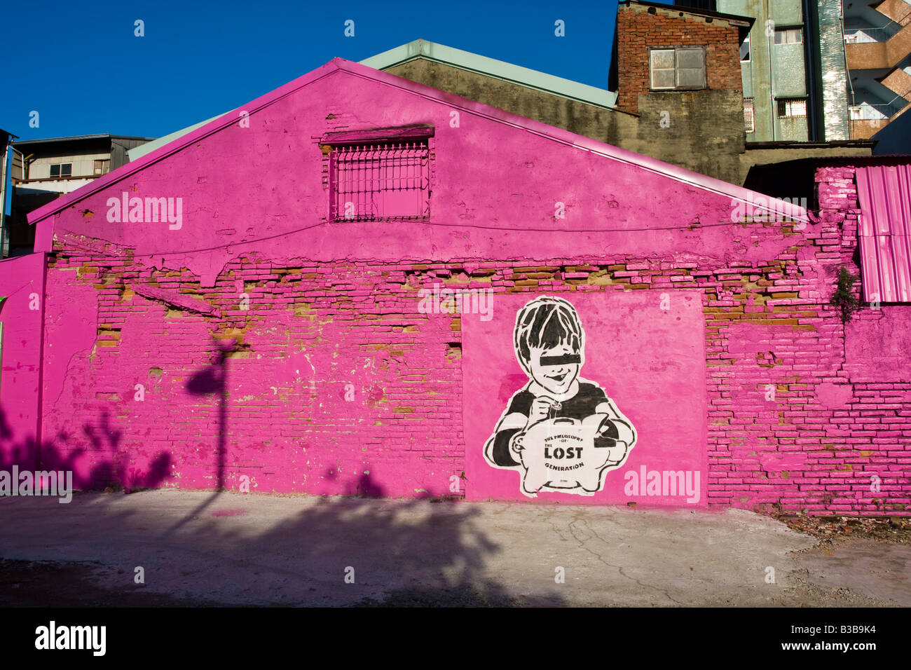 Property of the Lost Generation graffiti stencil on a bright pink building  Tainan Taiwan Republic of China (ROC Stock Photo - Alamy