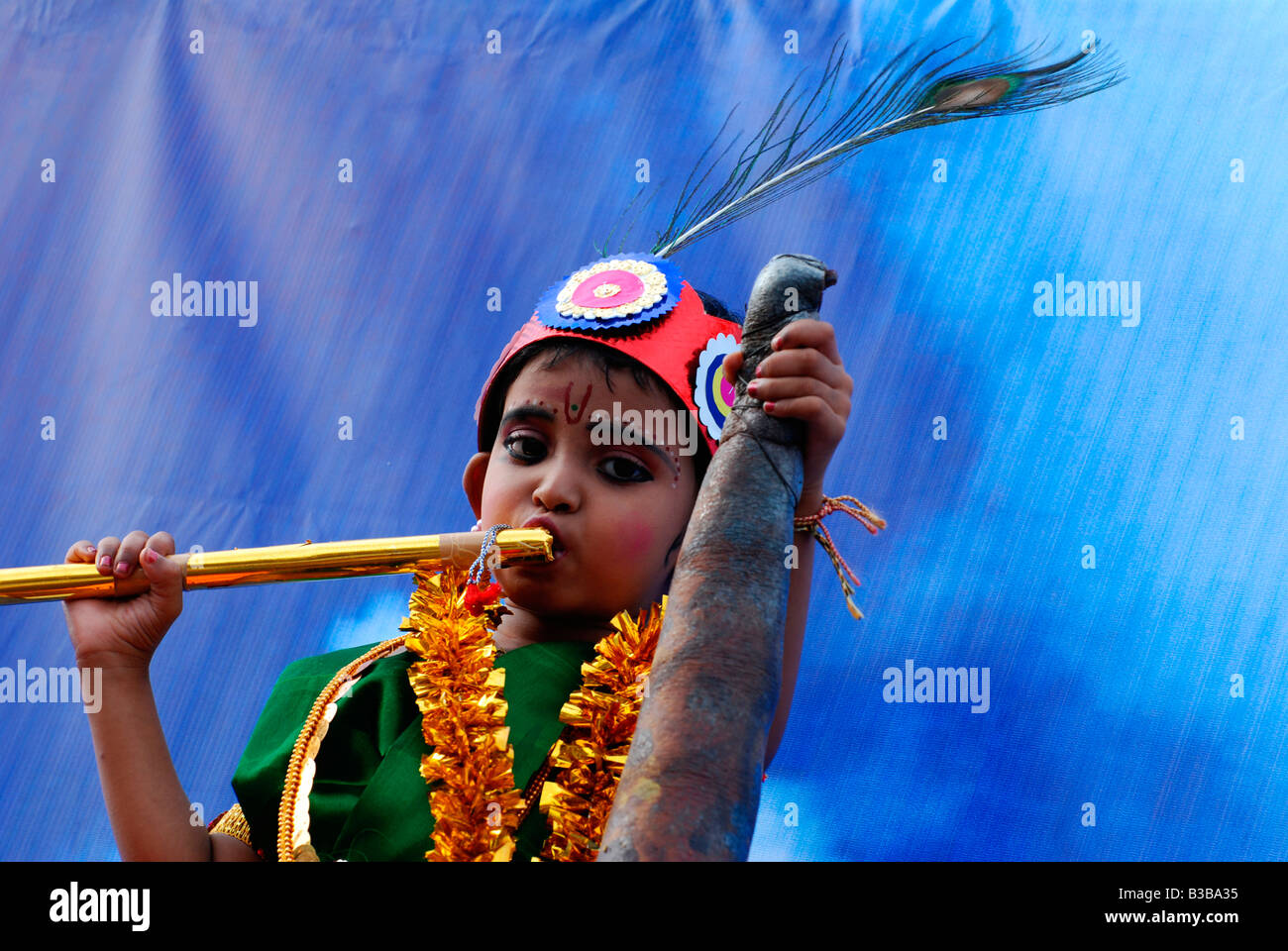 Little Krishna a small boy posing as lord krishna in a balagokulam