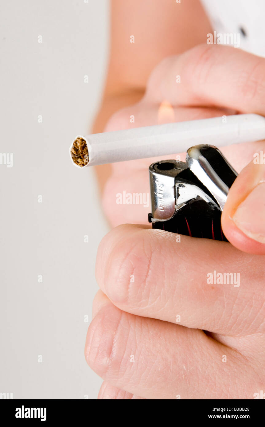 cigarette fag light lighting tobacco smoke smoker cigs ciggie lighter illness burn burning Stock