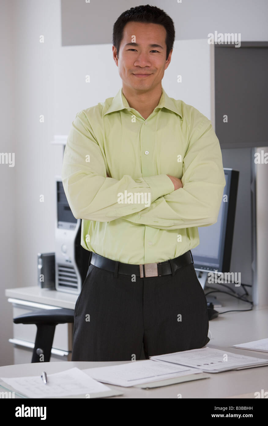 Asian businessman with arms crossed Stock Photo - Alamy