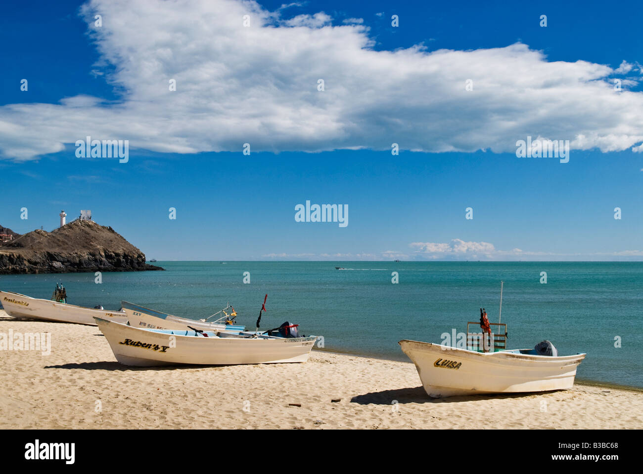 Fishing boats sit on sandy beach at Sea of Cortez, San Felipe, Baja California, Mexico Stock Photo