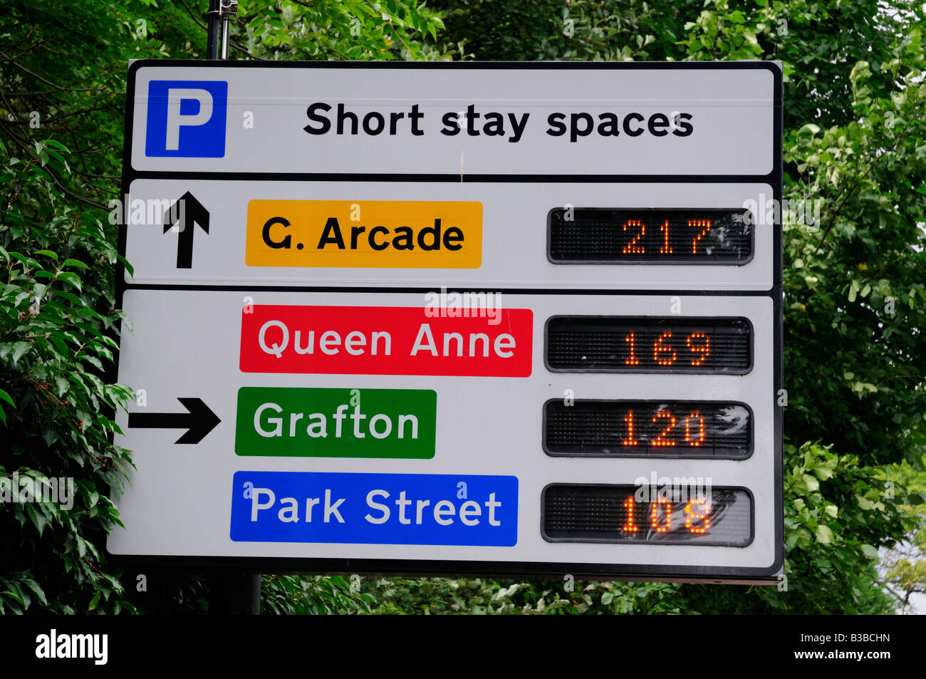 Electronic roadside board displaying available car parking spaces in city centre car parks, Cambridge England UK Stock Photo