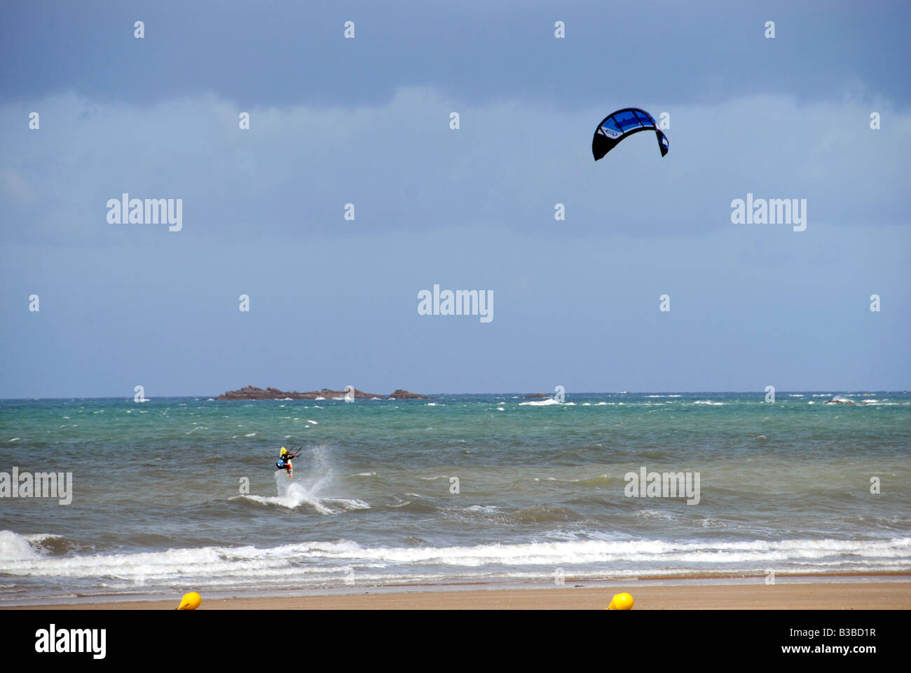 Kitesurfer is riding the waves hi-res stock photography and images - Alamy