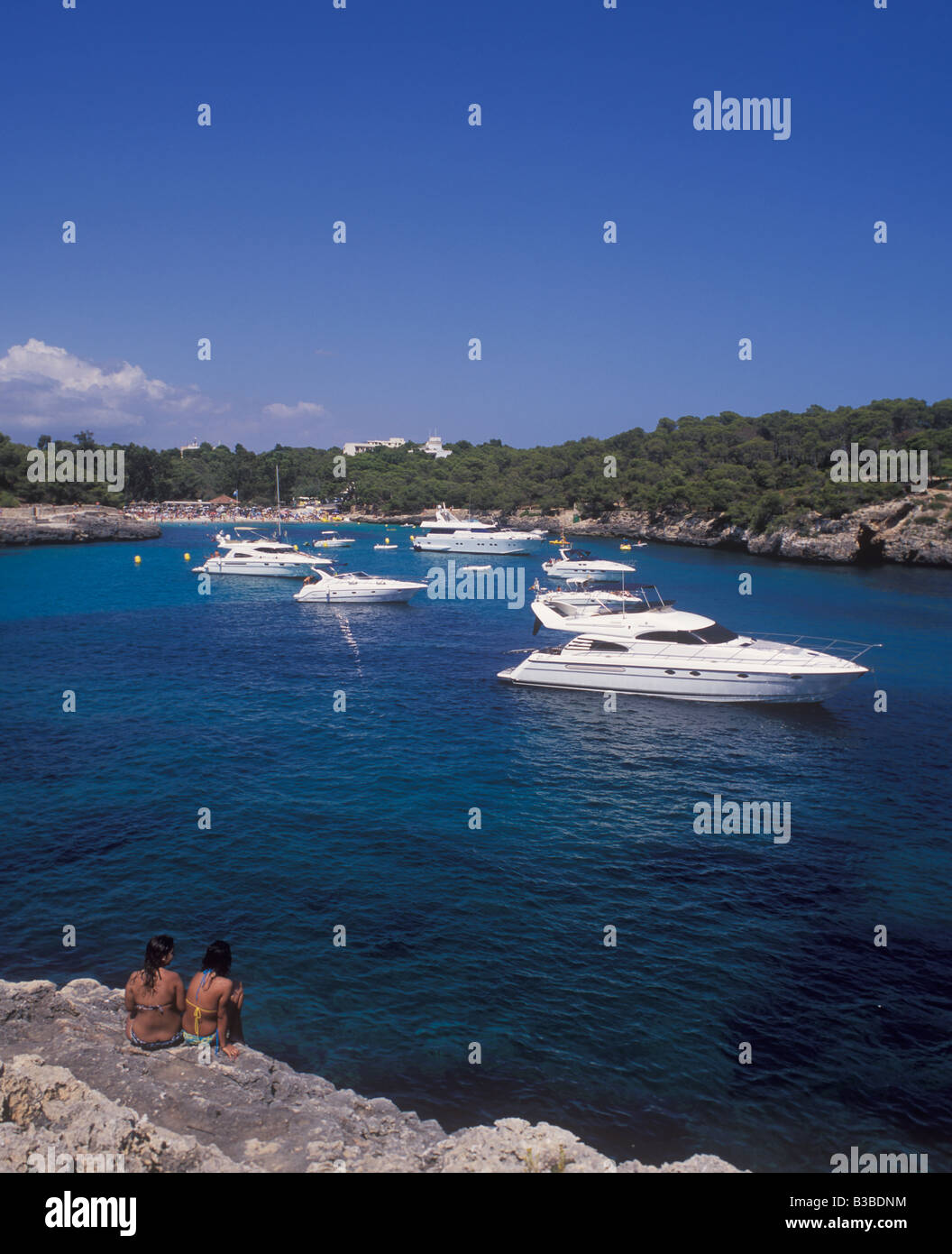 Scene in Cala Mondrago Natural Park - with motor boats and yachts at anchor  - near  Cala D'Or, East Coast Mallorca. Stock Photo